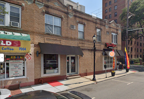 an old brick building on the corner of a city street