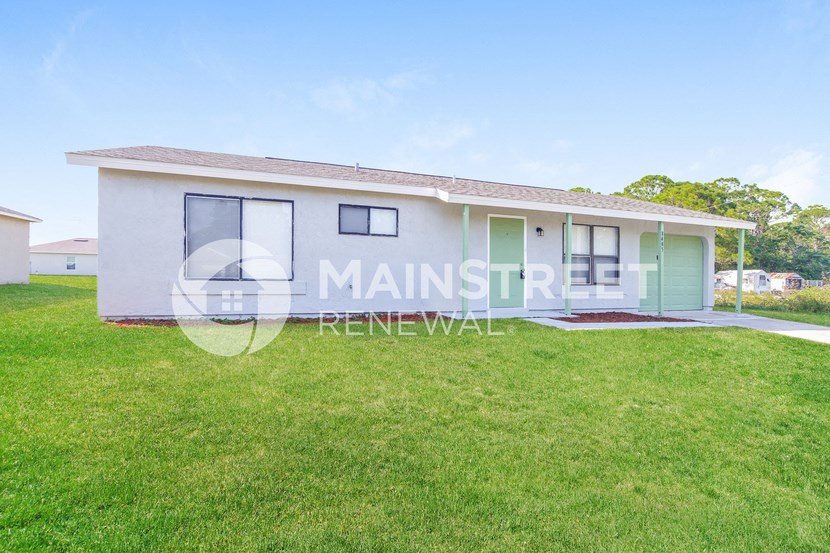 a small house with a lawn in front of it