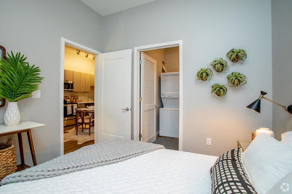 This is an alternate view of the master bedroom with the washer and dryer in the closet  at Grand Flats, St. Louis, 63104
