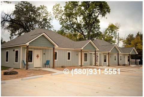 A row of houses with a phone number (580)931-5551 displayed on the image.