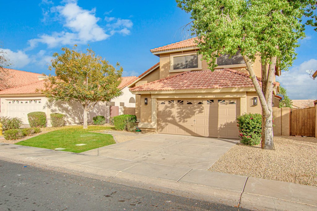 a house with a driveway and a garage door
