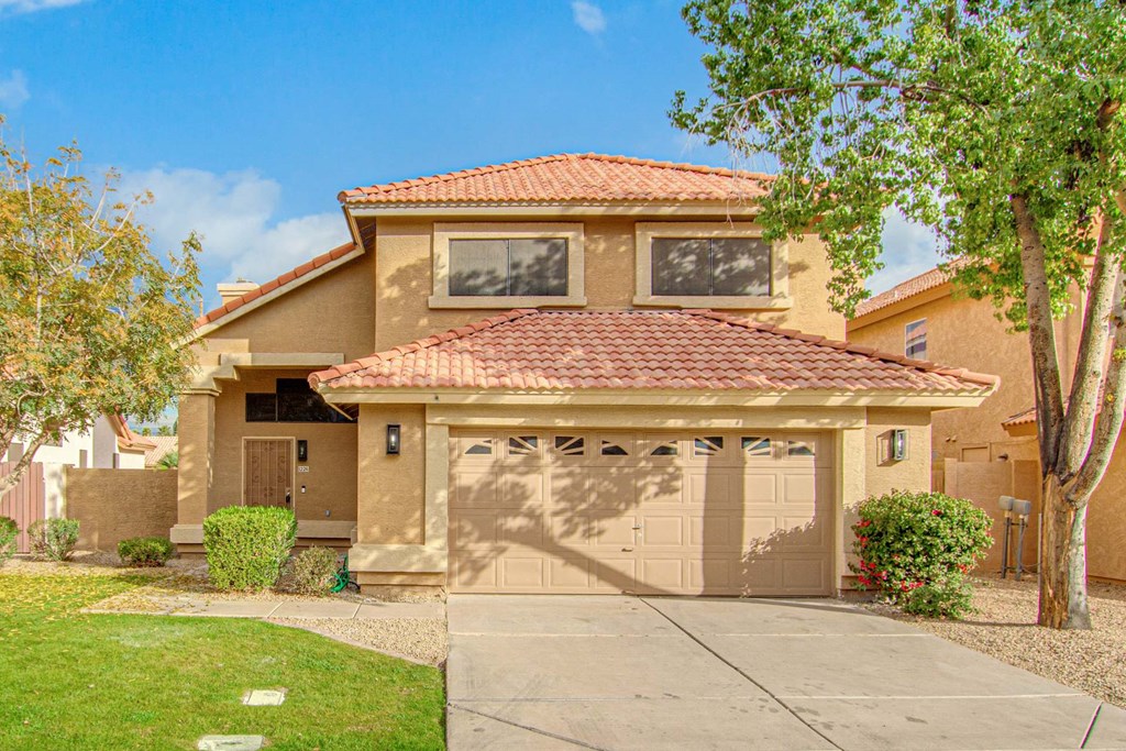 a house with a driveway and a garage door
