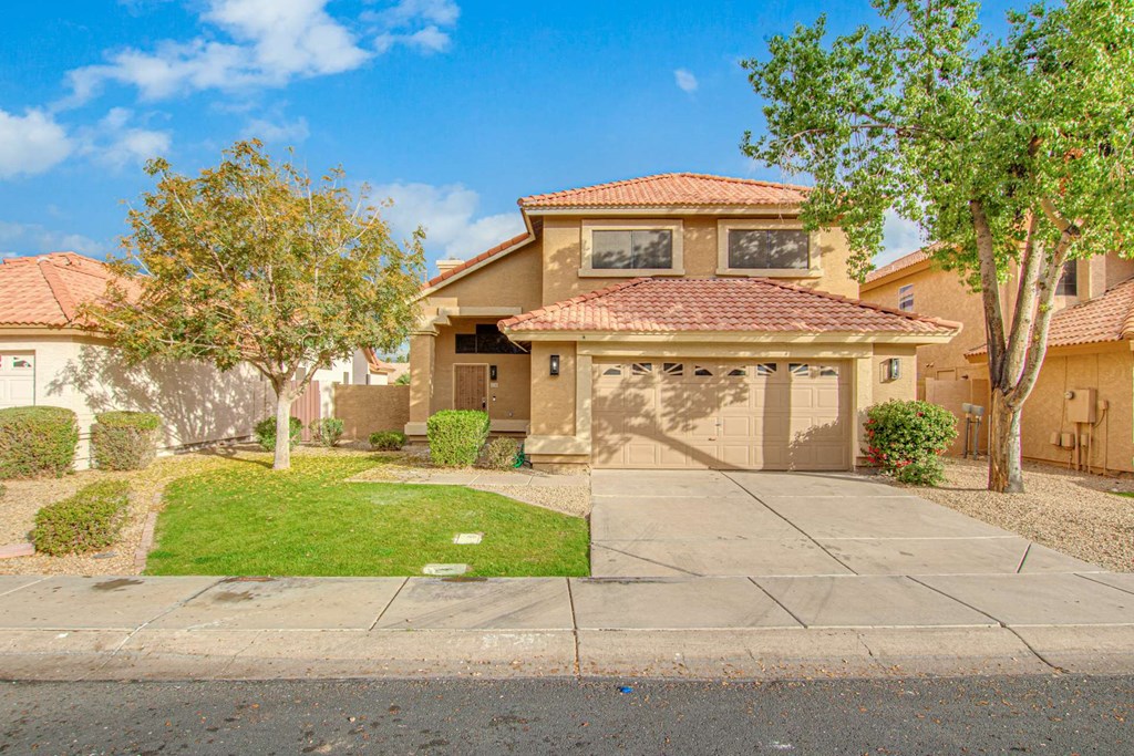 a house with a driveway and a garage door
