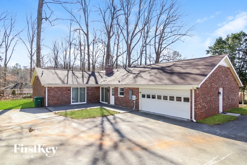 A house with a garage is for sale.
