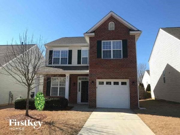 a brick house with a white garage door