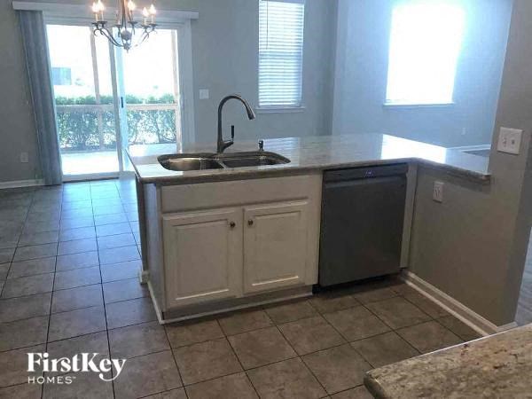 a kitchen with a sink and a counter top