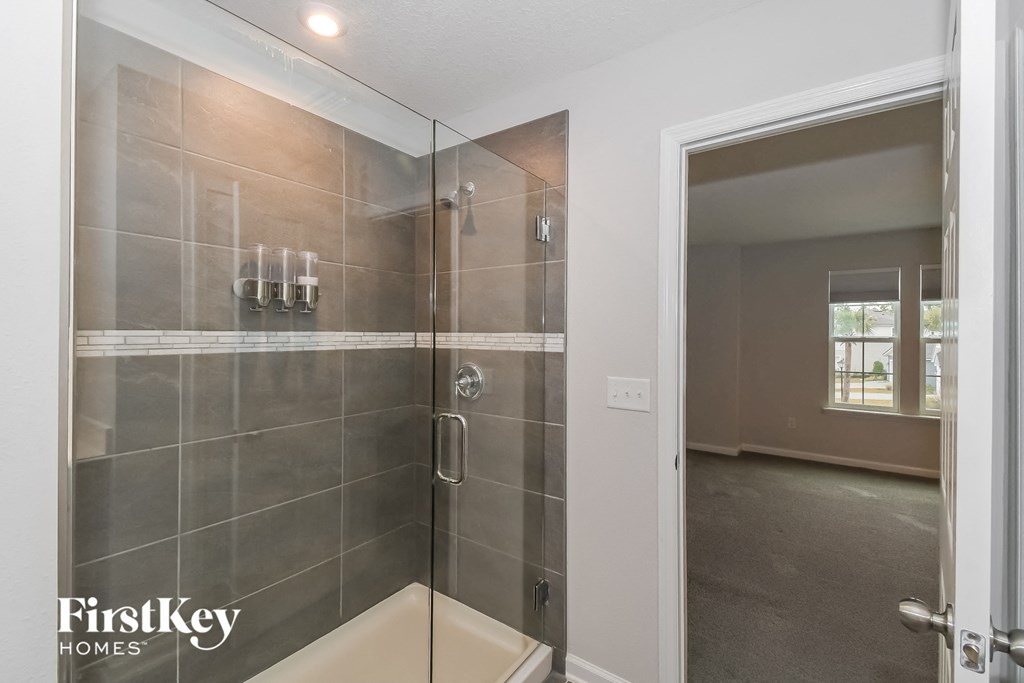 the master bathroom has a large walk in shower
