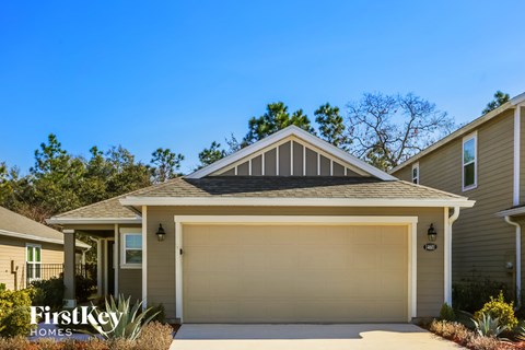 the front of a house with a garage door