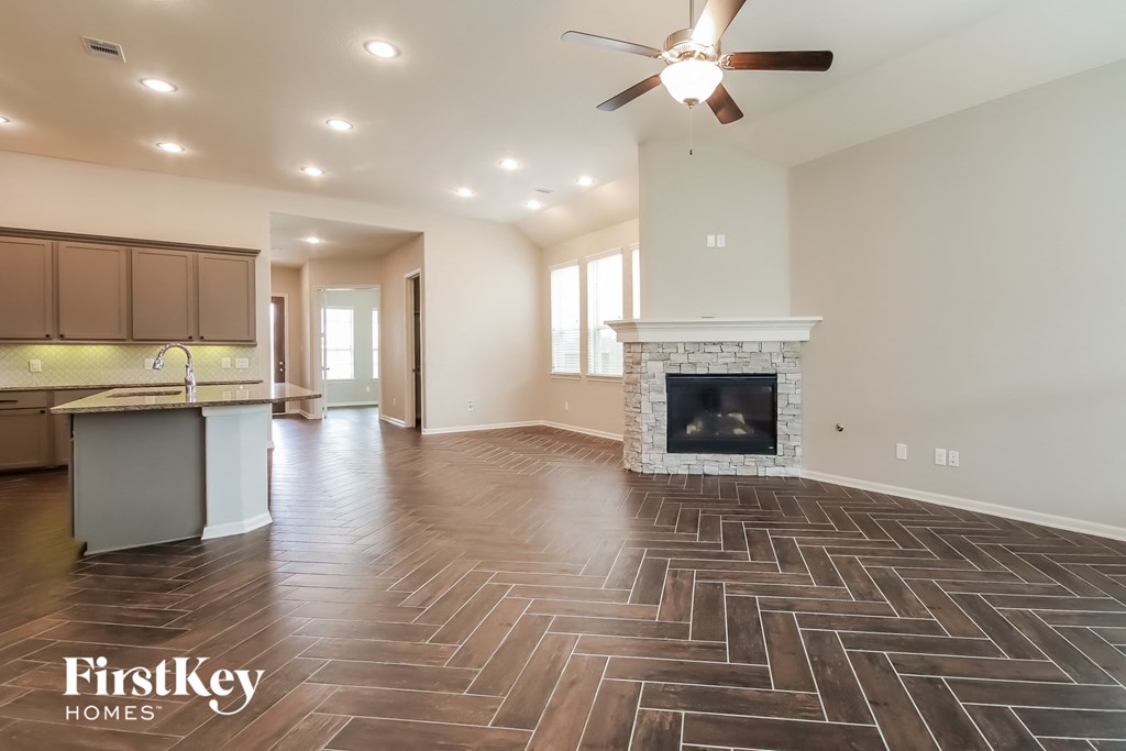 the view of the living room and kitchen from the family room