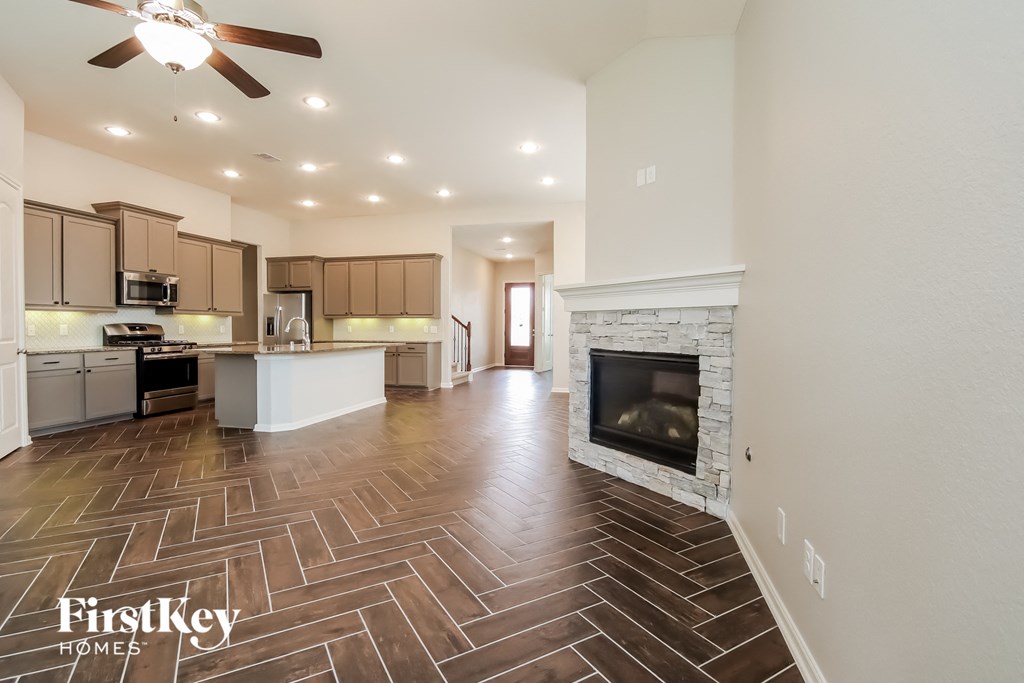 the living room is open to the kitchen and family room