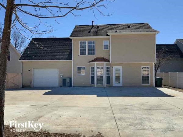 a house with a driveway and a white garage door