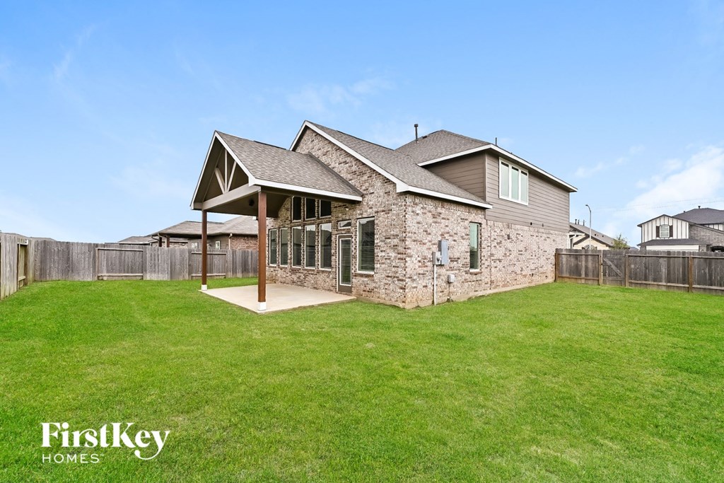 a backyard with a yard and a house