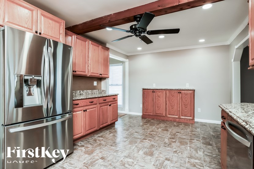 A kitchen with a FirstKey logo.