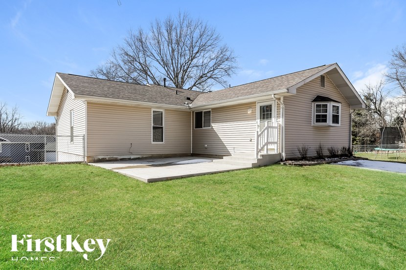 A house with a lawn in front of it.