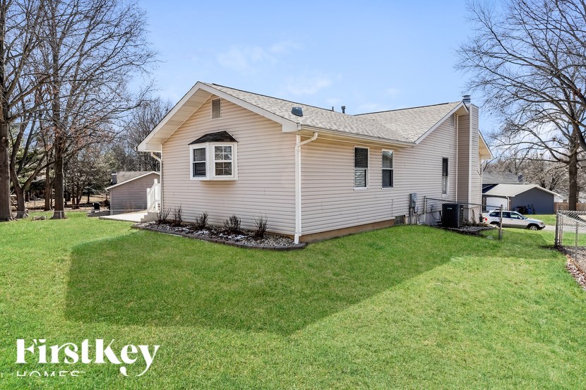 A house with a lawn in front of it.