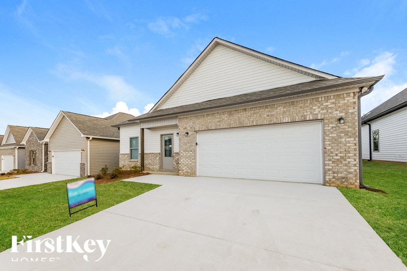A house with a garage is for sale by FirstKey Homes.