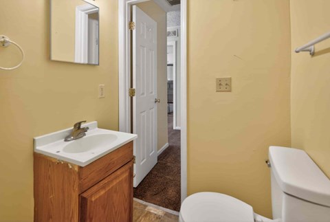 A bathroom with a sink, toilet and bathtub.
