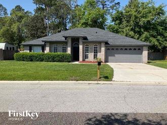 a house with a driveway and a parking meter
