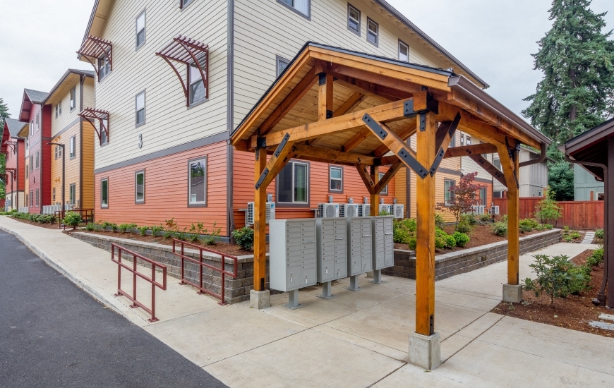 the outlook of a building with a patio with a wooden pavilion