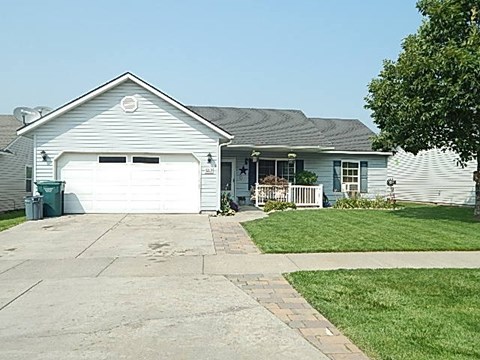 a white house with a white garage door