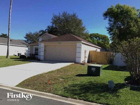 A house with a garage is for sale by FirstKey Homes.
