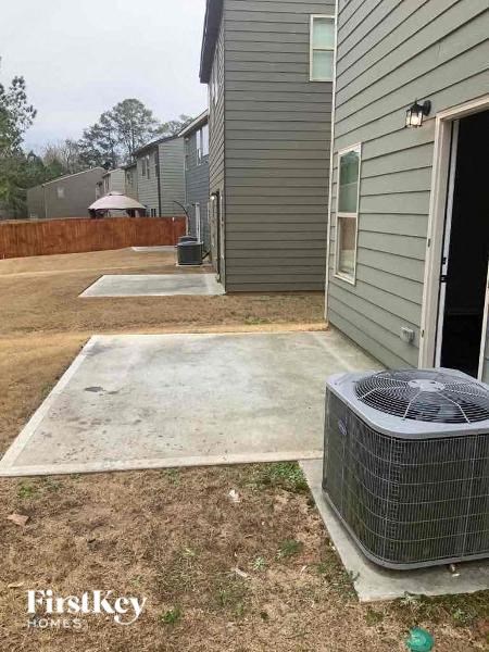 a patio outside of a house with a heater on it
