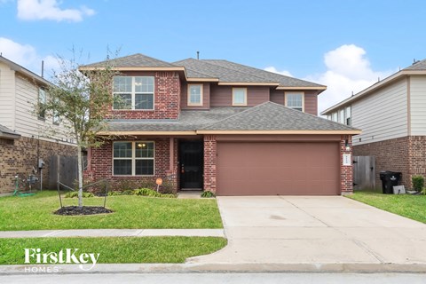 a house with a driveway and a garage door
