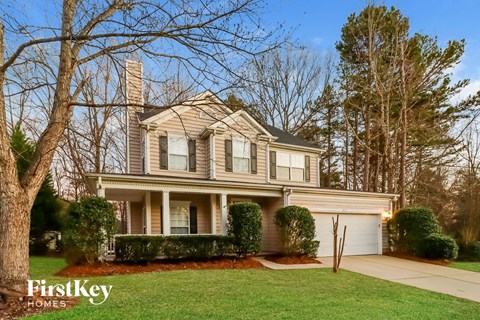 A house with a garage is for sale by FirstKey Homes.