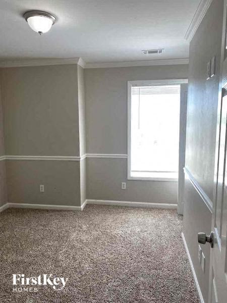 a empty room with a door and a window