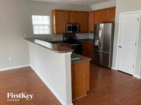 a kitchen with a counter top and a refrigerator