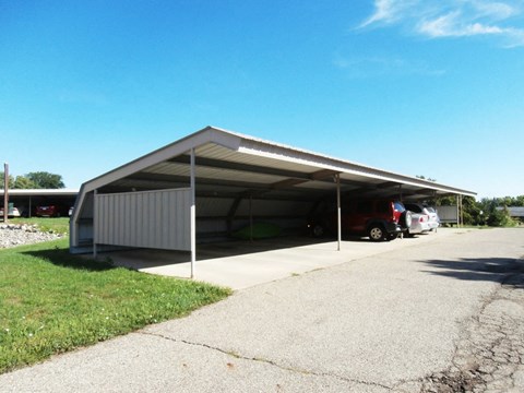 a car garage with cars parked in it
