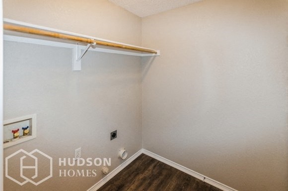 a room with a white wall and a white shelf on the wall