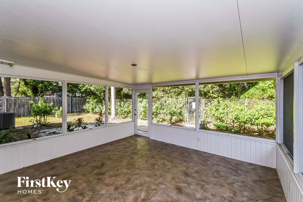 a living room with a large amount of windows