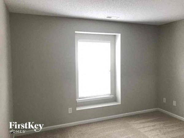 an empty room with a window in it