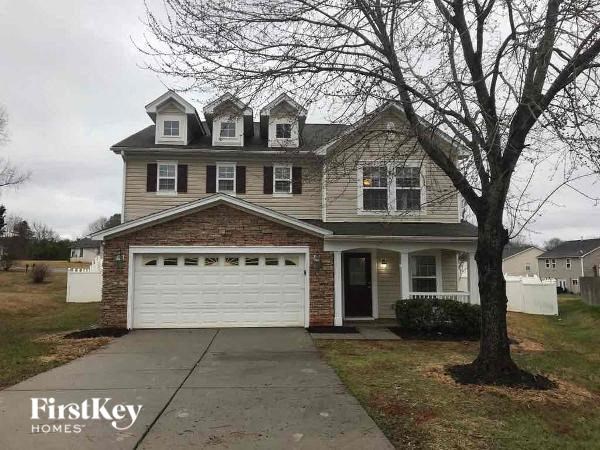 a brick house with a white garage door