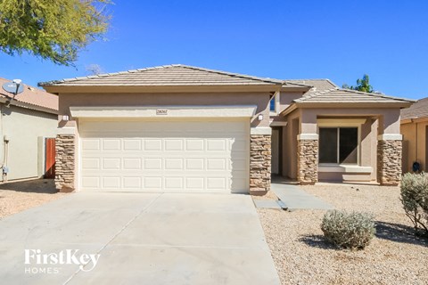 a single story home with a white garage door
