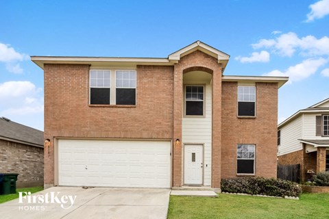 a brick house with a white garage door