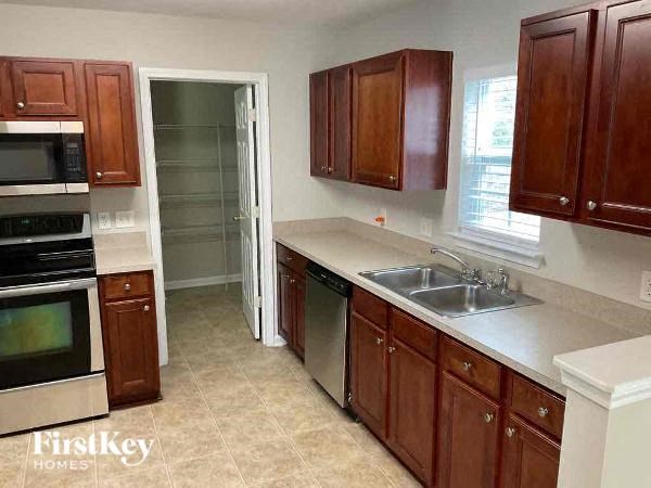 a kitchen with a sink and a window