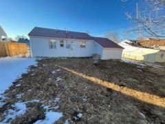 a white house with a yard in front of it