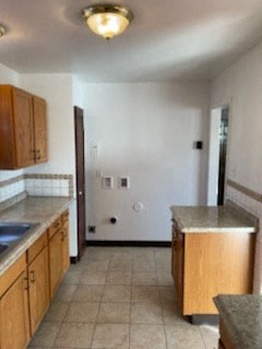 a kitchen with a sink and counter tops