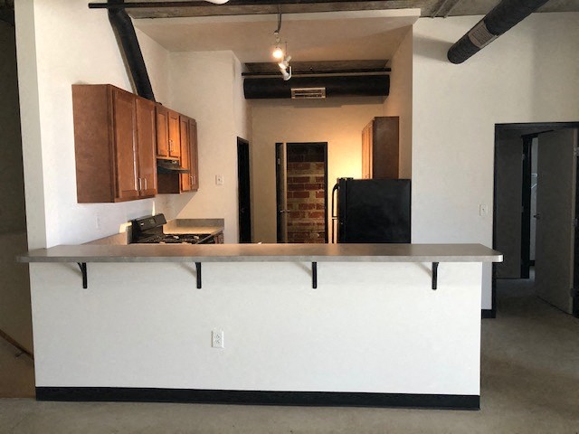 a kitchen with a counter top in a room