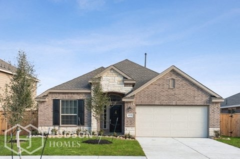 a house with a white garage door in front of it