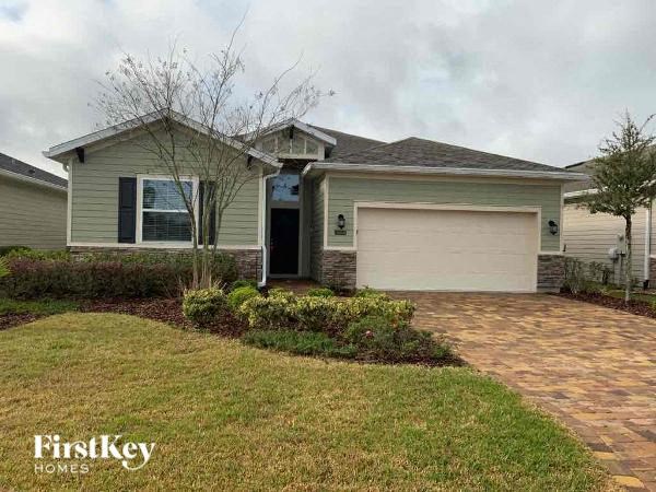 a house with a driveway and a garage door