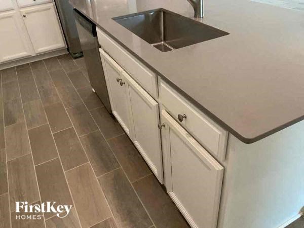 a kitchen with a sink and a counter top
