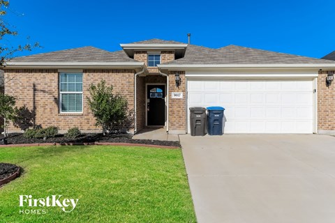 a house with a driveway and a garage door