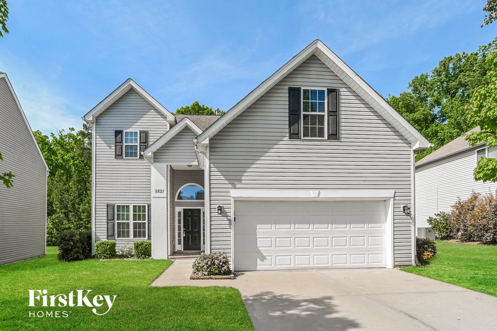 a white house with a white garage door