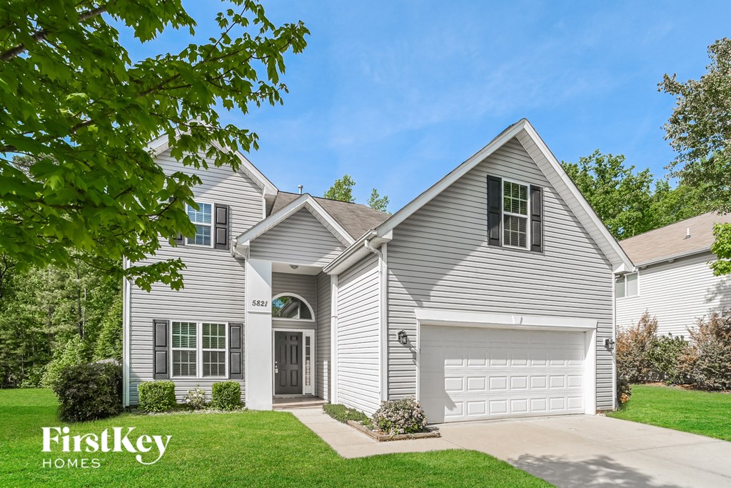 a white house with a white garage door