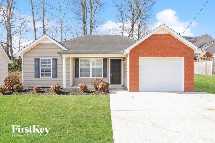 A house with a garage is for sale by FirstKey Homes.