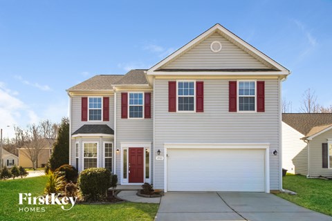 A two-story house with a garage is for sale by FirstKey Homes.