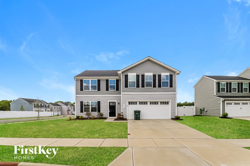 A house with a garage is for sale by FirstKey Homes.